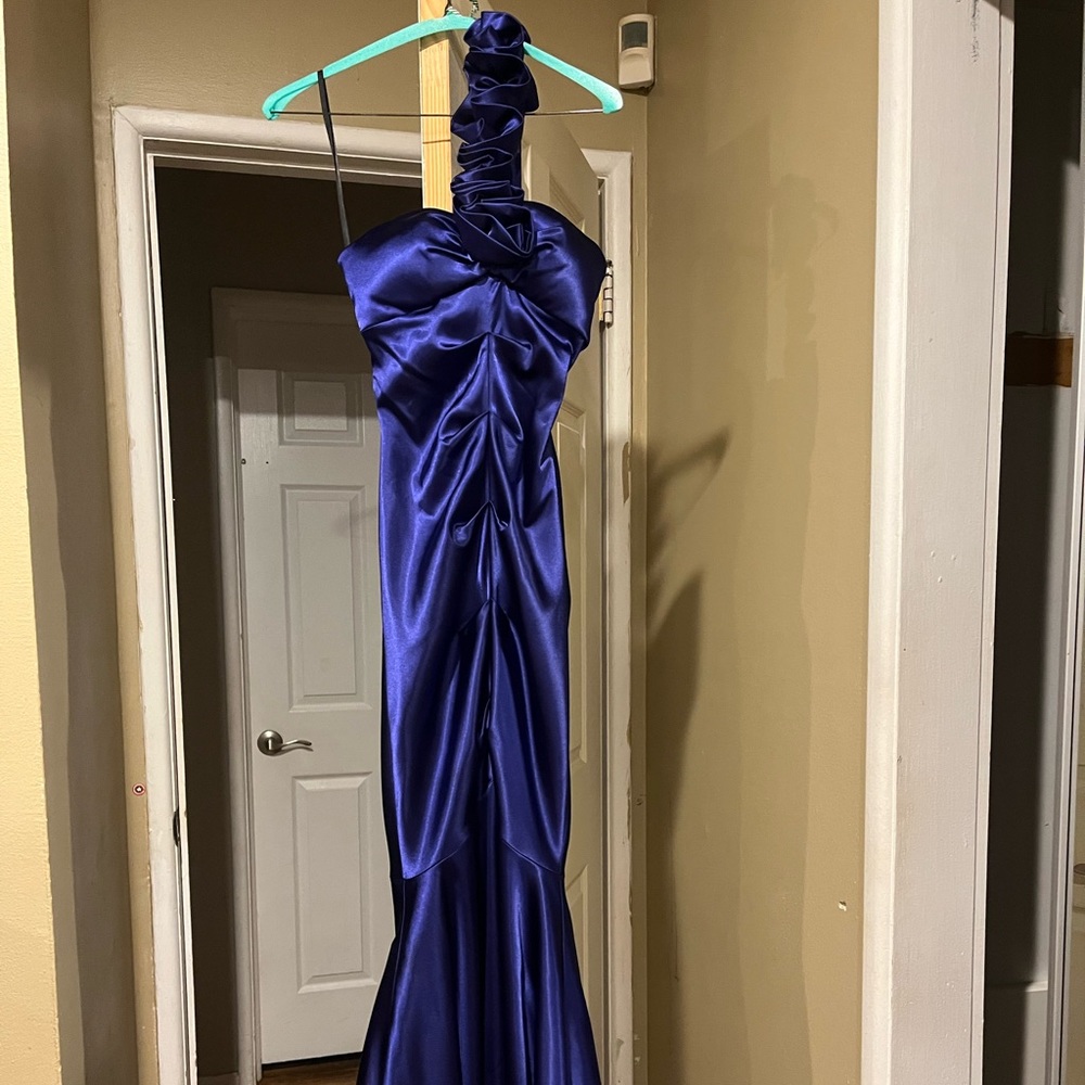 Beautiful purple satin mermaid gown with ruching on the front and back.
